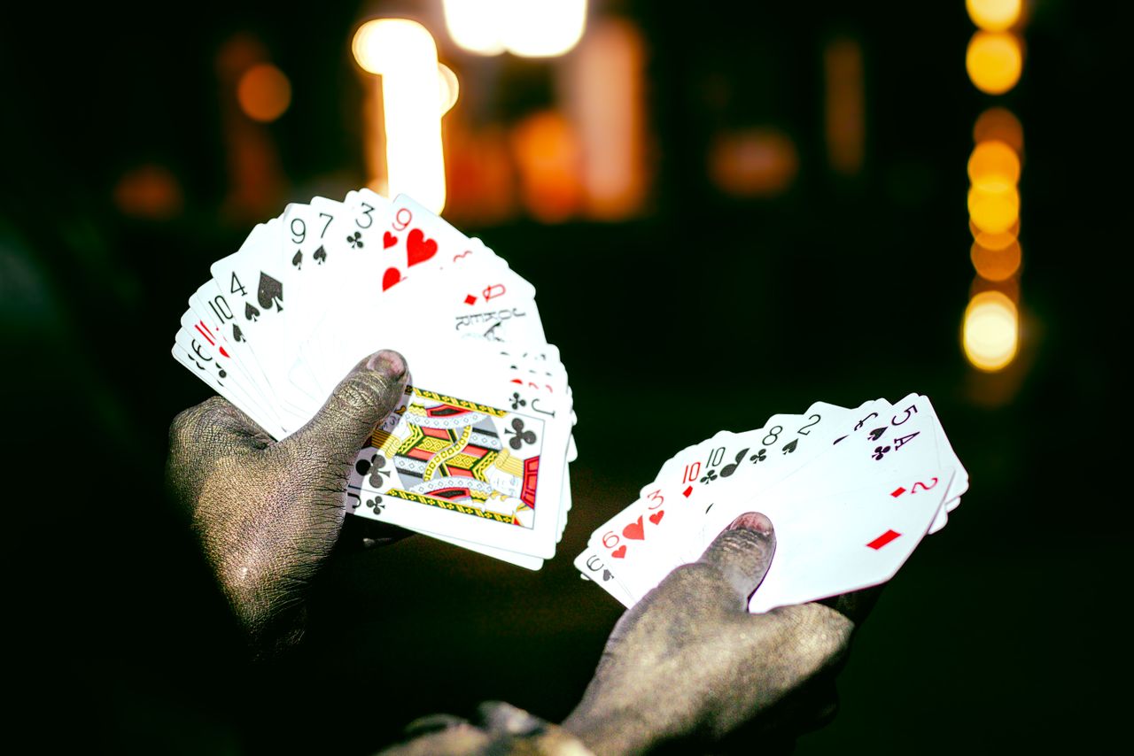Crafting Captivating Headlines: Your awesome post title goes here A magician showcases a deck of playing cards with dramatic lighting at night, highlighting a sense of mystery and intrigue.